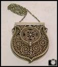 Early 20th century silver filigree amulet case and chain