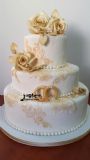 a wedding cake with sugarveil and gumpaste roses