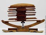1986, wood, wooden soles, bolt and wing nut, 65x43cm.