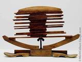 1986, wood, wooden soles, bolt and wing nut, 65x43cm